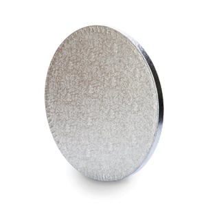a round piece of metal with a white background