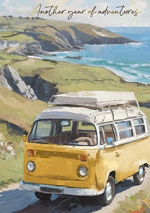 a yellow van is driving down a road next to the ocean .