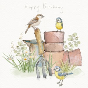 Wish someone a very Happy Birthday with this delightful card, part of our Open Birthday Female range from the Great British Card Company. This charming watercolour illustration captures a serene garden scene, complete with the handwritten "Happy Birthday" message at the top. Three sweet birds – a house sparrow and two blue tits – are nestled amongst rustic garden essentials like a watering can, fork, and terracotta pots. Delicate daisies and lush greenery add to the natural beauty. With its soft colour palette and gentle artistry, this card is a wonderful choice for any female recipient who appreciates nature's simple joys. Each pack contains 6 cards.