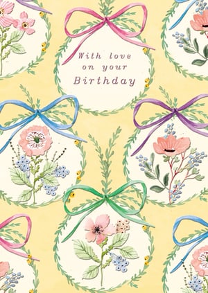 Celebrate birthdays with this delightful 'Open Birthday Female' card from the Great British Card Company. Featuring a charming watercolour design, this card showcases a beautiful repeating pattern of delicate floral wreaths, each adorned with a pretty ribbon bow in shades of pink, blue, purple, and green.

Inside one of these lovely wreaths, the heartfelt message 'With love on your Birthday' is elegantly displayed. The soft yellow background and intricate botanical illustrations create a truly special and feminine feel. Perfect for sending warm wishes to any female recipient, this card comes in a convenient pack size of 1x6, making it an ideal addition to your greeting card selection.