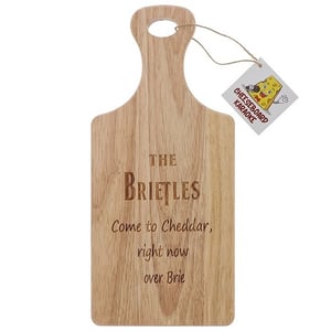 a wooden cutting board that says the briefles come to cheddar right now over brie