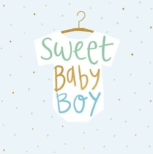 a baby boy 's shirt is hanging on a hanger with the words `` sweet baby boy '' written on it .