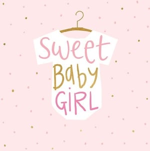 a baby girl 's shirt is hanging on a hanger with the words sweet baby girl written on it .