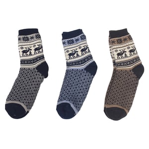 three pairs of socks with deer and snowflakes on them