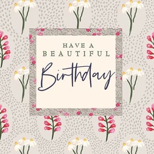 Send beautiful birthday wishes with this exquisite card from Ling. Featuring a charming design of delicate white daisies and vibrant pink bell-shaped flowers set against a soft, dotted background, it offers a truly lovely aesthetic. The central panel, framed with a subtle floral detail, beautifully displays the heartfelt message: 'Have a Beautiful Birthday' in elegant script and classic serif fonts. Perfect for celebrating any special woman, this card provides a graceful way to convey your warmest regards. Supplied in a handy pack of 6, it's an ideal choice for your retail collection.