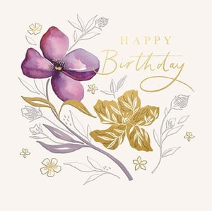 a birthday card with a purple flower and gold leaves .