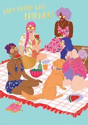 a group of women are having a picnic with a dog .
