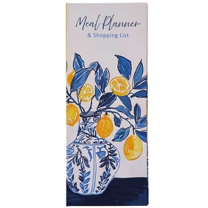 a meal planner with a vase of lemons on it