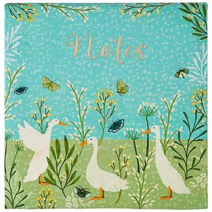 a notepad with a picture of ducks and butterflies on it