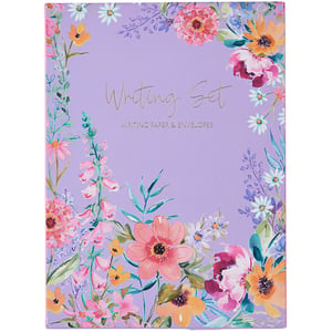 a purple writing set with flowers on it