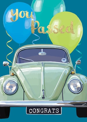 a car with balloons and the words " you passed " on it