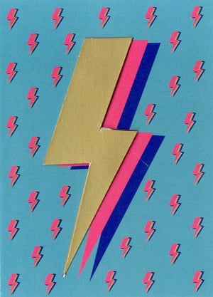 a paper lightning bolt with a pattern of lightning bolts on a blue background .