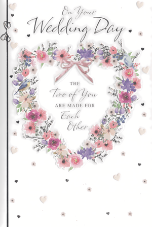 Celebrate love with our beautiful 'Wedding Day' card from Simon Elvin. This exquisite design features a charming heart-shaped wreath, adorned with delicate watercolour flowers in soft pinks, purples, and blues, creating a truly romantic feel. A sweet pink bow and subtle bird details add to its enchanting appeal.
The heartfelt message, 'The Two of You Are Made For Each Other', is elegantly presented within the floral heart, making it the perfect sentiment for any happy couple. Finished with scattered hearts for an extra touch of charm, this card is sure to be a popular choice for customers looking to share their warmest wishes.
Available in a convenient pack size of 1x6, ensuring your shelves are well-stocked with this lovely wedding card.