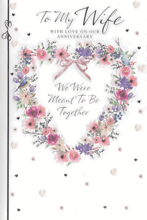 Offer your customers a truly heartfelt way to celebrate enduring love with our "Wife Wedding Anniversary" card from Simon Elvin. This beautiful design features an elegant heart-shaped wreath, adorned with delicate watercolour flowers in shades of pink, purple, and blue, complemented by charming little birds and a sweet pink ribbon bow.
The card's loving message, "To My Wife WITH LOVE ON OUR ANNIVERSARY" and "We Were Meant To Be Together," conveys deep affection and sentiment. Scattered hearts add a romantic touch to the pristine white background. Perfect for retailers seeking high-quality anniversary cards, this design is sure to resonate with customers. Each pack contains 6 cards, ensuring you're well-stocked with this popular choice.
