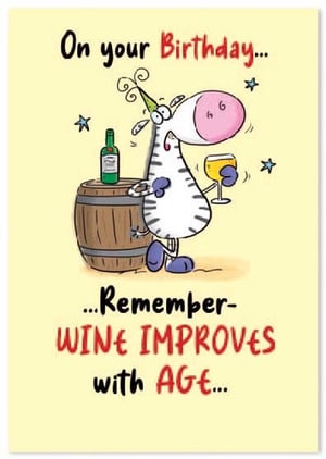 a zebra is standing next to a barrel holding a glass of wine and a bottle of wine .