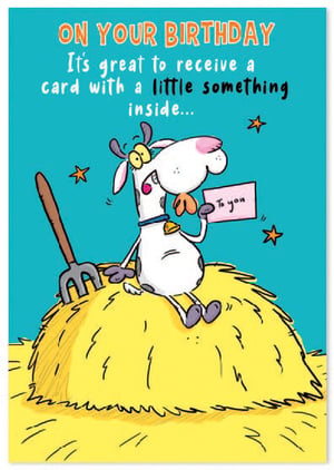 a birthday card with a cow sitting on a pile of hay