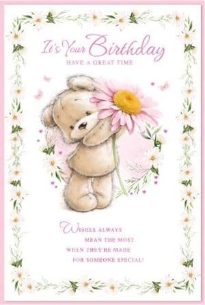 a teddy bear is holding a pink flower on a birthday card .