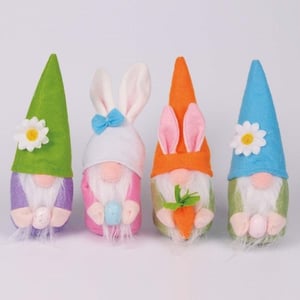 four stuffed gnomes with bunny ears and flowers on their hats
