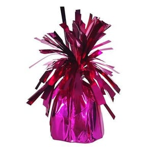 a pink balloon weight with tinsel on a white background .
