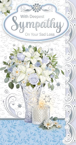 a sympathy card with a vase of flowers and candles