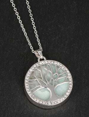 a necklace in a box that says furry companions collection