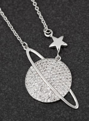 a necklace with a planet and a star on it