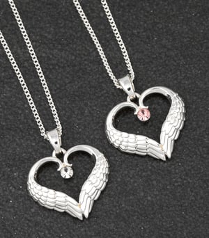 two heart shaped necklaces with wings and a pink stone