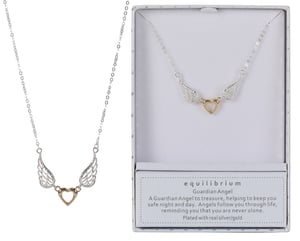 a necklace in a box that says equilibrium on it