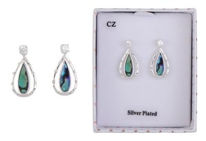 a pair of earrings and a pendant in a box on a white background .