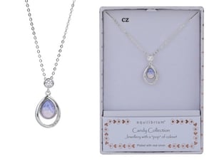 a necklace in a box that says candy collection