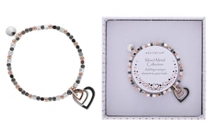 a mixed metal collection bracelet in a box