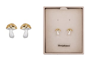a pair of silver gold plated mushroom earrings in a box