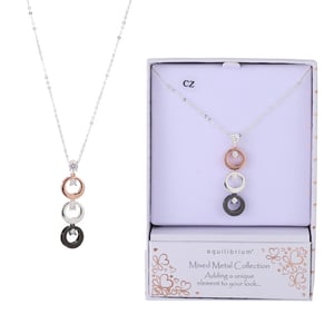 a necklace in a box that says mixed metal collection