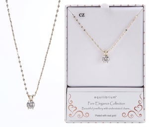 a necklace in a box that says equilibrium pure elegance collection