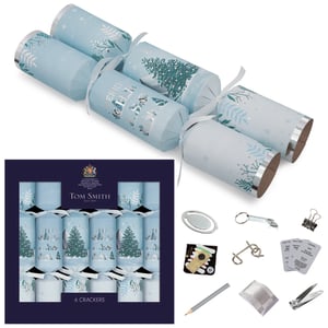 Bring a touch of serene winter magic to your festive celebrations with these exquisite 6 x 14" Arctic Premium Crackers from Tom Smith, supplied by Design Group. Each cracker boasts a sophisticated arctic blue design, adorned with elegant silver accents, frosted trees, and charming winter animals like polar bears and penguins.
These premium crackers are not just beautiful; they're packed with delightful surprises! Inside, guests will discover a variety of quality gifts, including a metal puzzle, a handy sewing kit, a stylish bookmark, a practical bottle opener, a pencil, and more. Sold as single packs of six, they're perfect for adding a touch of luxury and fun to any Christmas table. Make your festive season truly special with these stunning crackers.