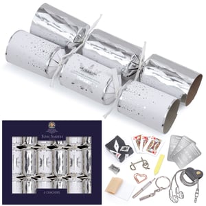 Add a touch of timeless elegance to your festive offerings with these stunning 6 x 8" Silver Tree Crackers by Tom Smith. Each single pack contains six beautifully crafted crackers, featuring a sophisticated silver and white design adorned with delicate snowflakes and sparkling stars. Perfect for Christmas dinner tables or seasonal gatherings, these crackers are filled with traditional fun. Guests will enjoy discovering a unique gift, a classic joke, and a festive hat inside. From mini games to handy novelties like a screwdriver keychain or earphones, there's a surprise for everyone. A festive essential from Design Group for your retail collection.