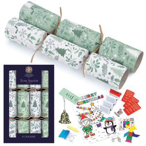Bring festive cheer to every Christmas table with our exquisite 8 x 12.5" Foliage Family Crackers. From the renowned Tom Smith brand, these crackers boast a beautifully elegant green and white foliage design, featuring charming Christmas trees, holly, and snowflakes, all tied with rustic twine for a natural, sophisticated look.
Each cracker promises delightful surprises for the whole family. Inside, discover a wonderful array of engaging contents, including fun colouring sheets with pens, festive ornaments, exciting puzzles, and classic jokes – perfect for keeping everyone entertained. Sold in convenient single packs of eight, these crackers are an essential addition to your seasonal offering, guaranteed to add a touch of magic to any celebration.