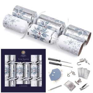 Elevate your festive celebrations with our exquisite 6 x 14" Snowfall Premium Crackers. Crafted by the renowned Tom Smith, these stunning crackers feature an elegant silver and white design, adorned with delicate snowflakes and winter foliage, perfect for adding a touch of sophistication to any Christmas table.
Each premium cracker promises a delightful surprise inside, from engaging metal puzzles and fun trivia cards to handy mini tools and charming novelties, ensuring a memorable moment for every guest. These beautifully presented crackers are an essential addition to your seasonal offerings, promising quality and festive cheer.