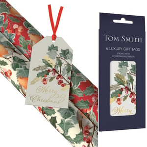 Help your customers add a touch of festive elegance to their gifts with these beautiful 6 Christmas Nest Tags from Design Group. Each luxury tag features a charming design of classic holly and berries, accented with delicate gold detailing and a "Merry Christmas" script. Pre-strung with a coordinating red ribbon, these tags are ready to use, offering a convenient and stylish finishing touch for any present. Ideal for retailers seeking to provide high-quality, coordinated Christmas accessories. Supplied in a wholesale pack size of 1x25, ensuring you're well-stocked for the festive season.