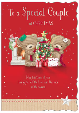 Introduce the charming 'Special Couple' Christmas card to your festive collection. Designed by Out of The Blue Studios Ltd., this delightful card features two adorable knitted teddy bears, one sporting a festive crown and the other a delicate flower, gathered around a beautifully decorated Christmas tree and a cosy fireplace.
The heartwarming message, "To a Special Couple at Christmas, May this time of year bring you all the