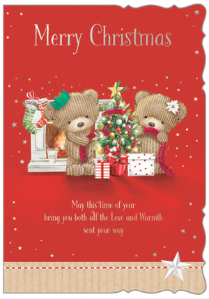 Spread festive cheer with this utterly charming Christmas card, perfect for sending warm wishes to a special couple or pair of friends. Featuring two adorable knitted teddy bears lovingly decorating their twinkling Christmas tree, this delightful design from Out of The Blue Studios Ltd. captures the magic of the season.

The sweet sentiment, "May this time of year bring you both all the Love and Warmth sent your way," is beautifully displayed on the vibrant red background, adorned with delicate stars and a cosy fireplace scene. This 'Open' Christmas card is a wonderful way to share your festive greetings. Each pack contains 6 identical cards, ready to bring smiles this holiday season.