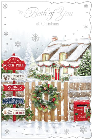 Bring the magic of Christmas to your customers with this enchanting 'To Both Of You' Christmas card from Out of The Blue Studios Ltd. This delightful design features a whimsical snowy North Pole scene, complete with a cosy cottage, a traditional post box for Santa's letters, and a welcoming wreath.
The charming illustration includes fun directional signs pointing to Santa's Workshop, the Reindeer Barn, and Mrs. Claus' Kitchen, adding a touch of festive cheer. Perfect for sending warm wishes to a special couple or two friends, this card beautifully captures the true spirit of the season. Available in a convenient pack of 6, it's a wonderful addition to your seasonal greeting card collection.