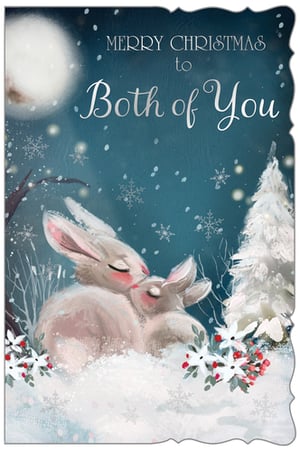 Share the magic of Christmas with our enchanting 'To Both Of You' card, brought to you by Out of The Blue Studios Ltd. This truly heartwarming design captures a tender moment between two adorable bunnies, nestled in a serene, snow-covered landscape under a shimmering moon. Delicate snowflakes fall around them, alongside festive white flowers and vibrant red berries, creating a truly picturesque winter scene. The elegant 'Merry Christmas to Both of You' message makes it the perfect choice for sending warm, loving wishes to a special couple. Available in a convenient pack of 6, these cards are sure to delight and spread festive cheer this holiday season.