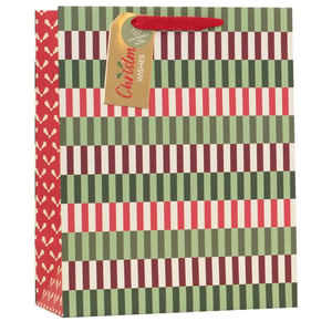 Elevate your festive offerings with our Large Christmas Essentials Gift Bag, perfect for making every present shine! This generously sized bag boasts a contemporary striped design in traditional Christmas hues of rich red, forest green, and creamy off-white. The striking red side panel features a charming, subtle pattern, adding an extra touch of elegance. Each bag is finished with a durable red ribbon handle and includes a beautiful gold "Christmas Wishes" gift tag, proudly highlighting its eco-friendly and 100% recycled credentials. Ideal for a wide range of gifts, these bags are supplied in a convenient pack of 6 by Partisan Products Ltd., ensuring you're well-stocked for the season.