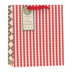 Get ready for the festive season with our charming Medium Christmas Essentials Gift Bag! Perfect for presenting those special Christmas gifts, this bag features a delightful design of classic red and cream wavy stripes on the main panels. The side gussets add an extra touch of elegance with a cream and dark green snowflake diamond pattern. Each bag comes complete with sturdy red ribbon handles and a lovely eco-friendly gift tag that reads "Wishing you a very Merry Christmas," highlighting its 100% recyclable nature. Supplied by Partisan Products Ltd in a convenient pack of 6, these bags are a must-have for any retailer looking to offer stylish and sustainable gift packaging this holiday.