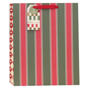 Make your festive gifts shine with our Large Christmas Essentials Gift Bag! This eye-catching design features classic red and deep green vertical stripes, accented with a charming patterned side panel for a touch of unique elegance. Each bag comes complete with a festive 'HOHOHO' gift tag, proudly declaring its eco-friendly and 100% recyclable credentials – a thoughtful detail your customers will appreciate.
With sturdy red handles, these bags are perfect for carrying all those special Christmas presents. Supplied by Partisan Products Ltd., they offer both quality and style. Available in a convenient pack of 6, they're an essential addition to your seasonal retail offering. Spread joy and sustainability this Christmas!