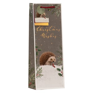 Elevate your Christmas gifting with our charming Christmas Hedgehog Bottle Bag! This delightful bag is perfect for presenting wine, spirits, or other bottled treats during the festive season. It showcases an endearing design of hedgehogs nestled in a snowy landscape, adorned with classic holly and berries. Elegant "Christmas Wishes" script adds a warm touch. Plus, with its eco-friendly credentials, as highlighted by the tag, it's a thoughtful choice for conscious consumers. The sturdy red string handle ensures easy and secure carrying. Available in a convenient pack of 6, these bags are an ideal addition for retailers seeking unique and heartwarming gift packaging that customers will adore.