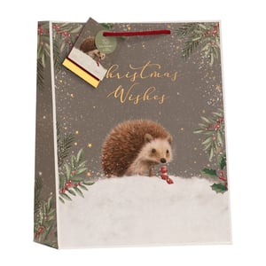Bring a touch of woodland charm to your Christmas gifting with our Large Christmas Hedgehog Gift Bag from Partisan Products Ltd. This delightful bag features an adorable hedgehog nestled in a snowy scene, surrounded by festive foliage and sparkling stars. Golden 'Christmas Wishes' script adds a warm, seasonal touch.
Crafted with care, these large gift bags are perfect for presenting a variety of gifts. Plus, with an 'Eco-Friendly' tag, you can offer your customers a sustainable choice this holiday season. Each pack contains 6 of these charming bags, ready to add a special touch to any present.