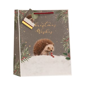 Make every gift extra special this Christmas with our charming Medium Christmas Hedgehog Gift Bag. This delightful bag showcases an adorable hedgehog amidst a serene snowy landscape, adorned with festive holly, berries, and pine. Golden 'Christmas Wishes' script and twinkling stars add a touch of magic. Its versatile medium size is ideal for a variety of presents, while sturdy red rope handles ensure easy carrying. Plus, with an eco-friendly tag, your customers can gift responsibly. Available in wholesale packs of 6, these bags are a perfect addition to your seasonal offerings.