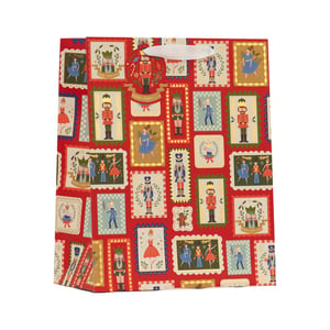 Bring the magic of the festive season to your customers with our enchanting Medium Nutcracker Gift Bag. This delightful bag features a classic Nutcracker ballet theme, presented in a charming stamp-like pattern against a rich red background. Adorned with a variety of beloved characters, including gallant Nutcracker soldiers and graceful ballerinas, many highlighted with shimmering gold accents, it's sure to make any gift extra special. Perfect for Christmas presents, this eye-catching bag offers a touch of traditional holiday cheer. Stock up for the busy season – these festive bags are supplied by Partisan Products Ltd in a convenient pack of 6.